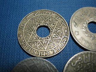 Lote 4 monedas antiguas con agujero