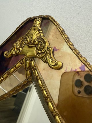 Espejo en forma de arco de herradura mozárabe