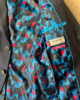 Americana azul niño con forro multicolor. Talla 11