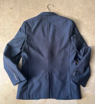 Americana azul niño con forro multicolor. Talla 11
