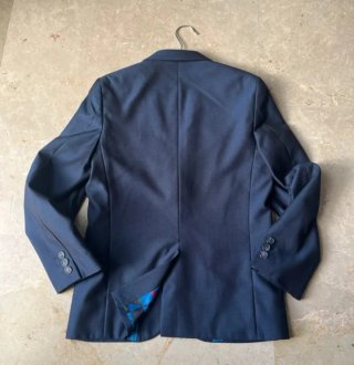Americana azul niño con forro multicolor. Talla 11