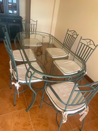 Mesa de cristal y 6 sillas de forja