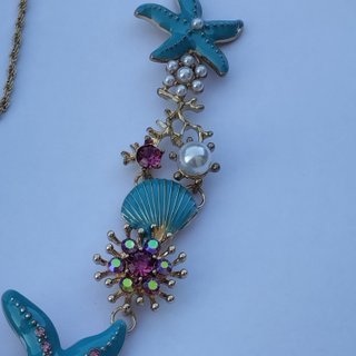 Collana stile marino con stelle marine e conchigli