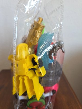 Bolsa de Juguetes: Coche, Dinosaurio, Figura Dorad