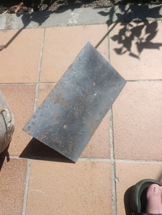 Cubo, llana y paleta de albañilería