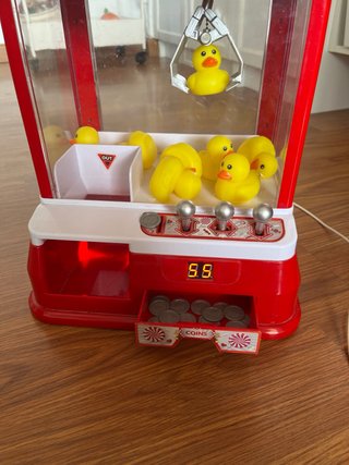 Máquina de gancho con patos