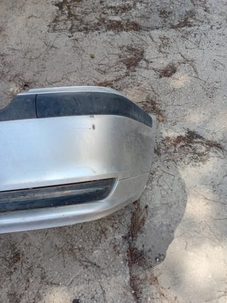 Paragolpes trasero plateado