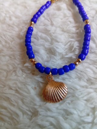 Pulsera concha azul y dorada