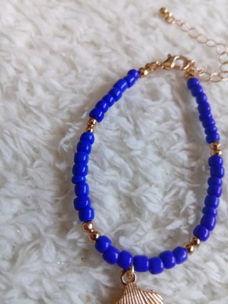 Pulsera concha azul y dorada