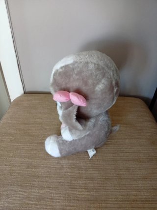 Peluche cagnolina con nastri rosa