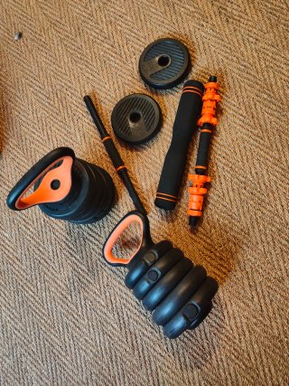 Juego de pesas y rodillo abdominal