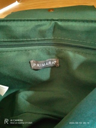 Bolso de mano Primark verde con cadena dorada