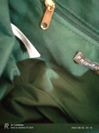 Bolso de mano Primark verde con cadena dorada