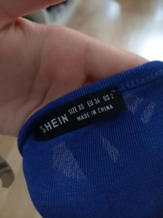 Top asimétrico azul Shein
