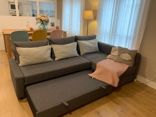 Sofá cama con chaiselongue, gris oscuro