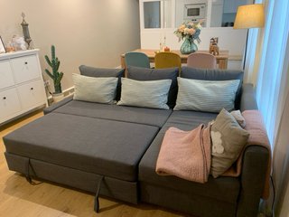 Sofá cama con chaiselongue, gris oscuro