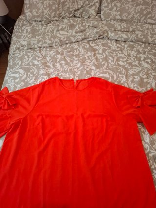 Blusa naranja con volantes en manga