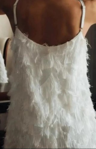 Vestido blanco corto con flecos