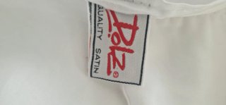 Sábana de raso blanca con tira bordada