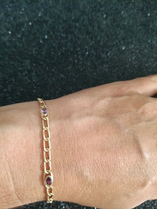 Pulsera de oro 18 kilates con piedras moradas