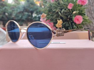 Gafas de sol Miu Miu doradas y azules
