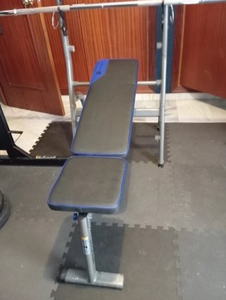 Banco de pesas con soportes y barra