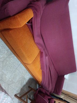 Sofá individual naranja de tela