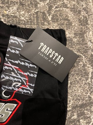 Tuta Trapstar nera e multicolore