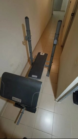 Banco de pesas, barras, discos y maletín