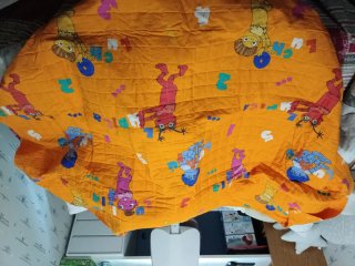 Edredón infantil naranja con dibujos