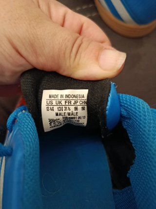 Botas de fútbol Adidas niño azul y naranja