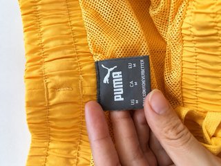 Bañador corto deportivo Puma amarillo