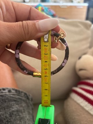 Bracciale Louis Vuitton marrone con fiori