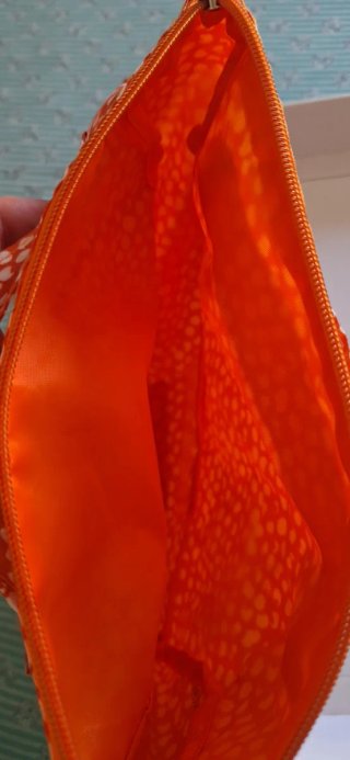 Pochette Collistar arancione con pois bianchi