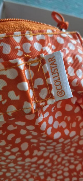 Pochette Collistar arancione con pois bianchi
