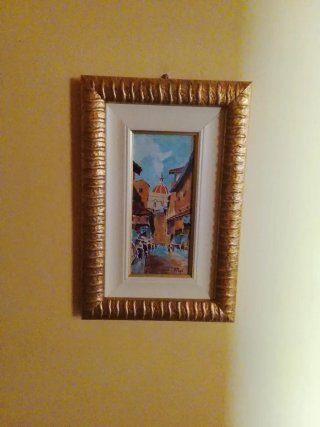 Quadro con cornice dorata