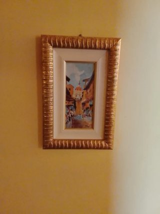 Quadro con cornice dorata