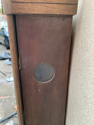 Reloj de pared antiguo de madera