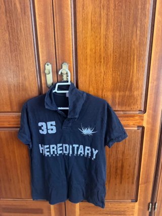 Camisa polo negra Hereditary