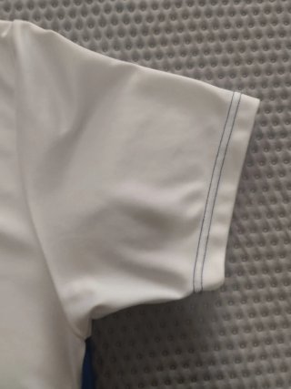 Camiseta deportiva Attendis blanca y azul