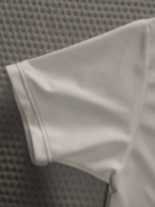 Camiseta deportiva Attendis blanca y azul