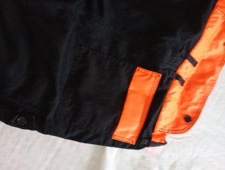 Pantalón trabajo anticorte naranja y negro