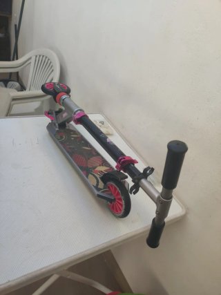 Patínete Oxelo fucsia y negro