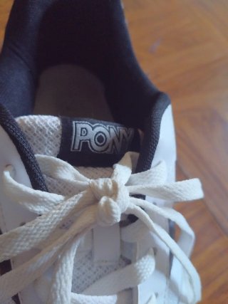 Zapatillas de fútbol sala Pony blancas y negras