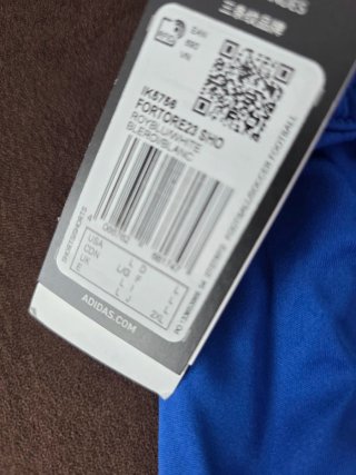 Pantalones cortos Adidas azules y blancos