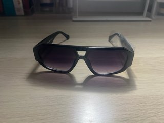Gafas de sol Louis Vuitton negras y doradas
