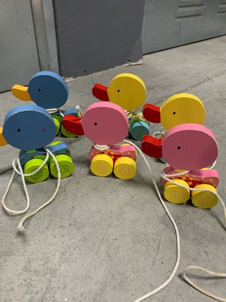 Juguetes de patos de madera para tirar