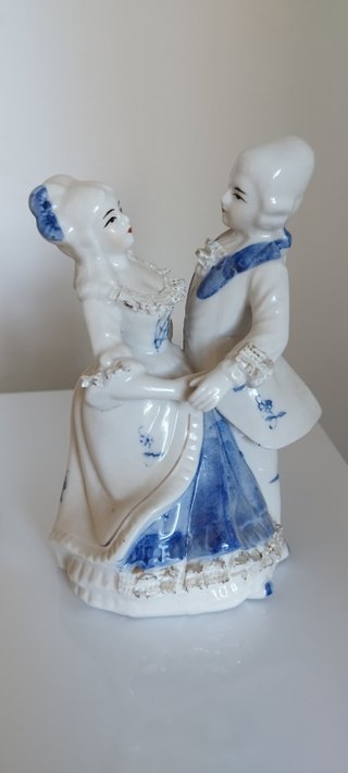 Lote vintage: Reloj kumo y figura lladró.
