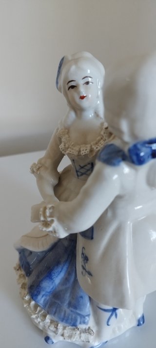 Lote vintage: Reloj kumo y figura lladró.
