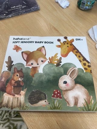 libro sensorial de tela para bebés de la marca...